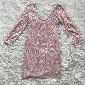 Peach/pink and white lace long sleeved dress